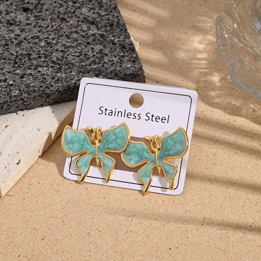 Aretes de mariposa borde dorado