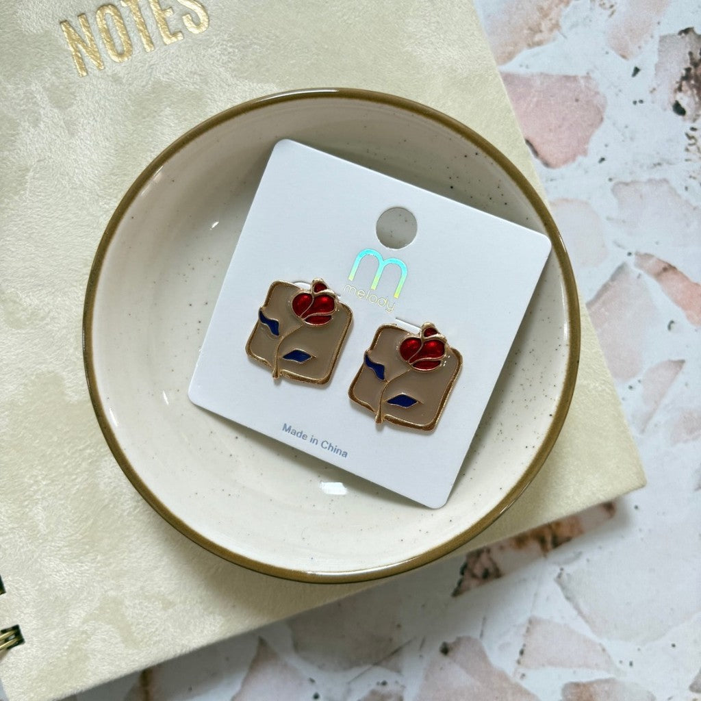 Aretes de rosa con fondo