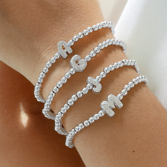 Pulsera de inicial plateada