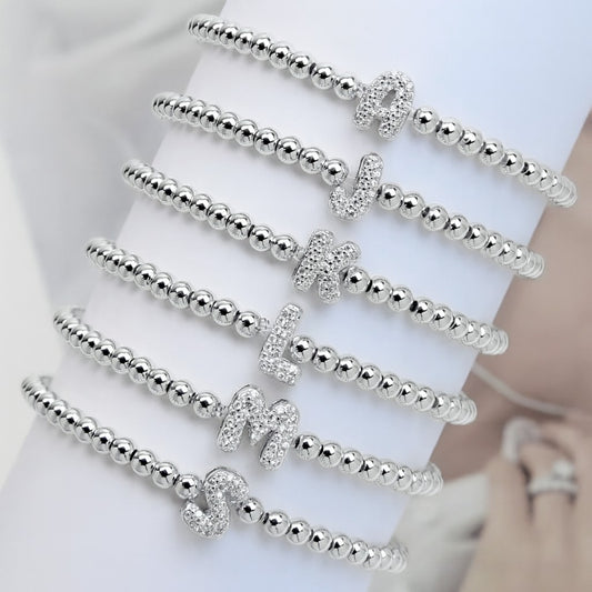 Pulsera de inicial plateada