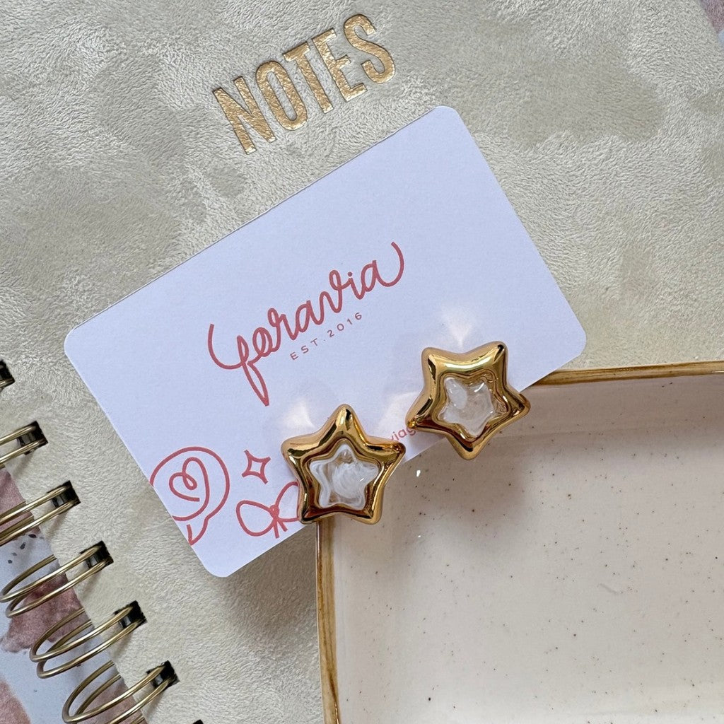 Aretes estrella blanca con dorado
