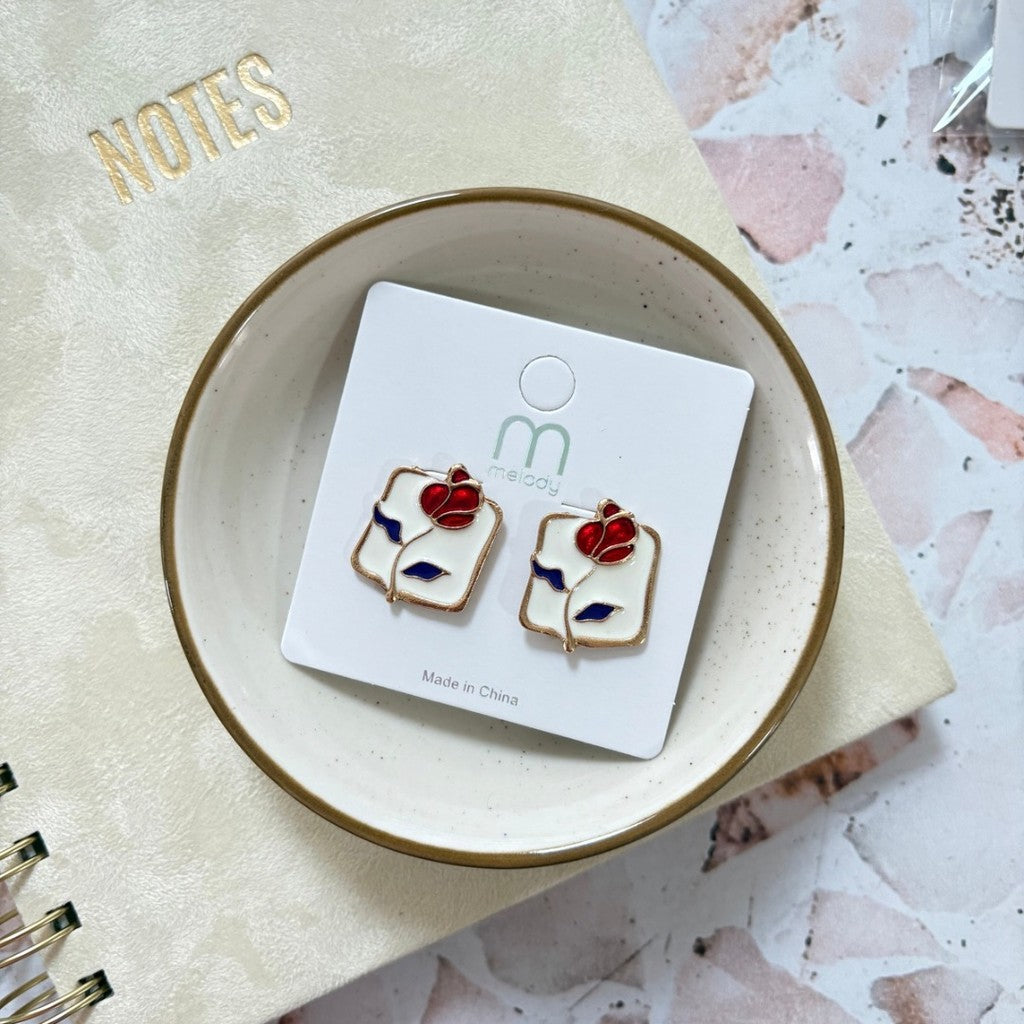 Aretes de rosa con fondo