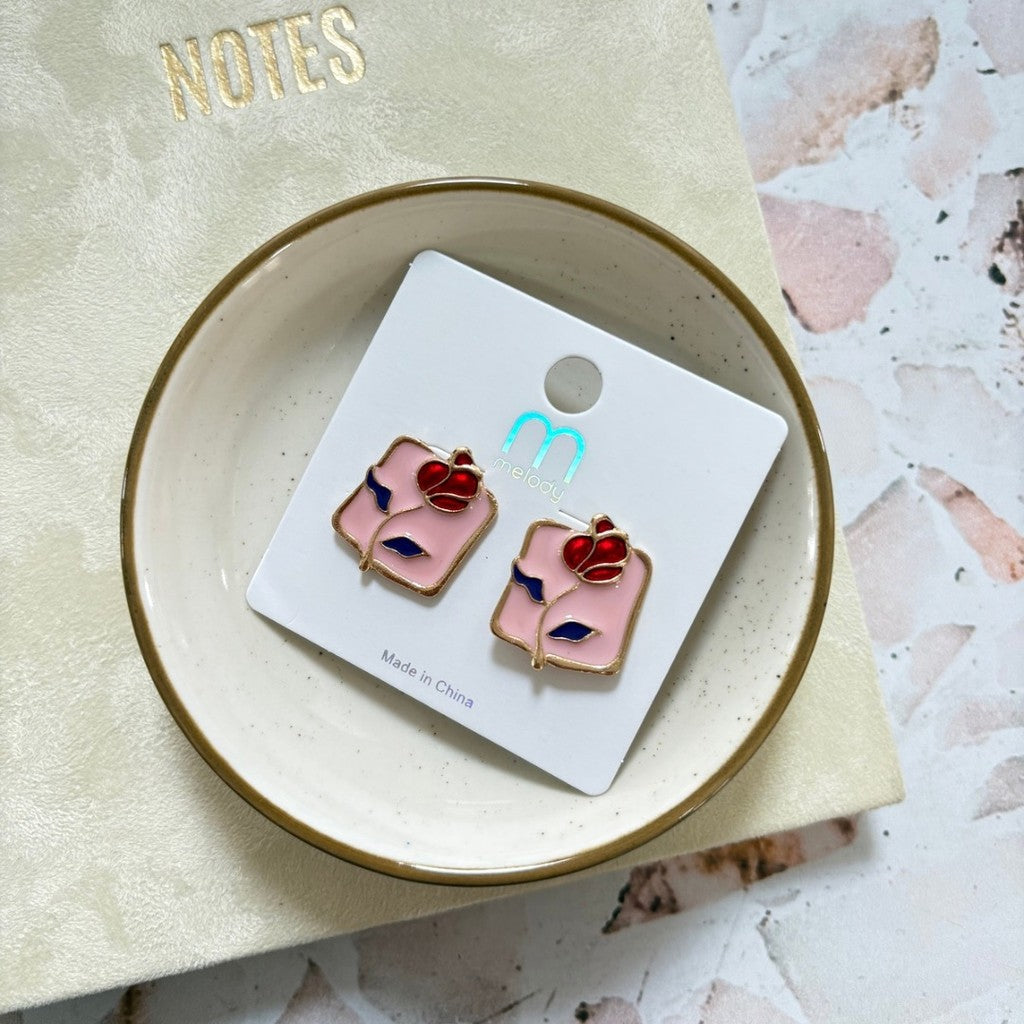Aretes de rosa con fondo