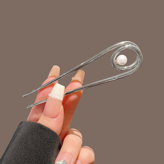 Pinza francesa con perla