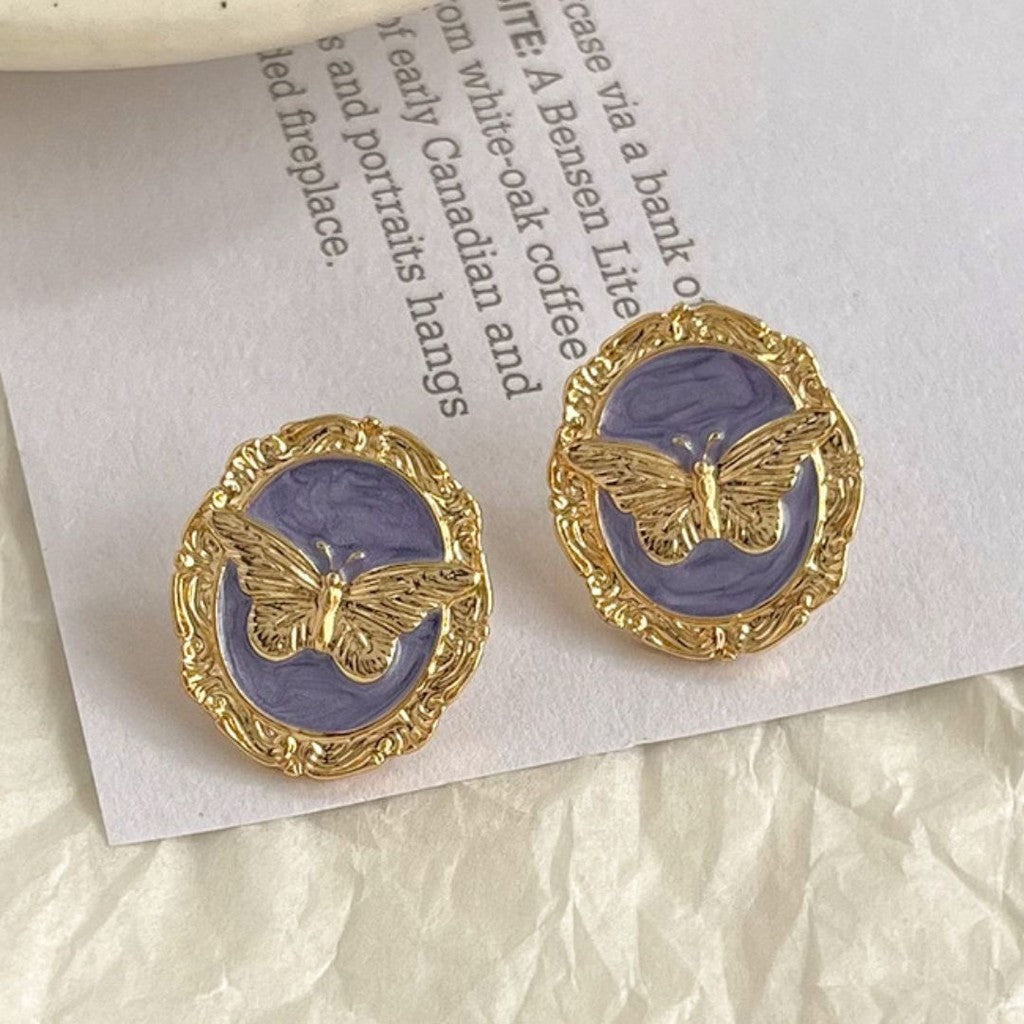 Aretes de mariposa dorada