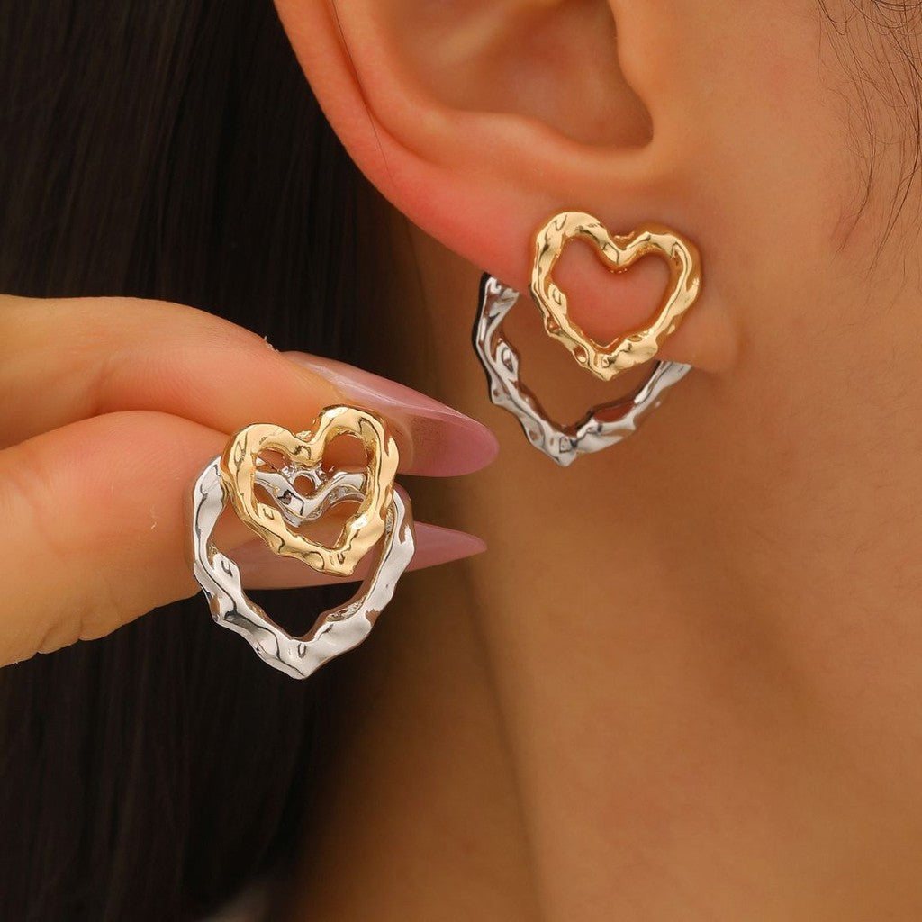 Aretes doble corazon bi color